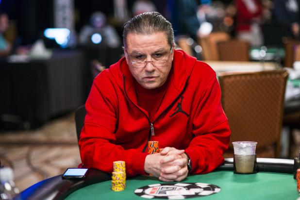 Eli Elezra playing poker wearing a red hoodie