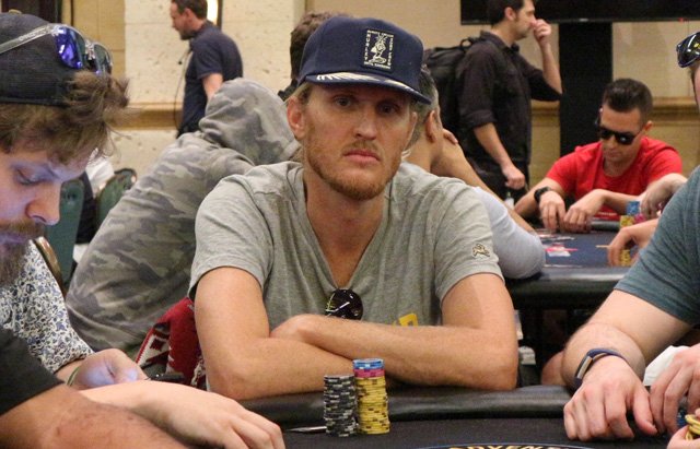 Tyson Apostol playing poker with a blue cap